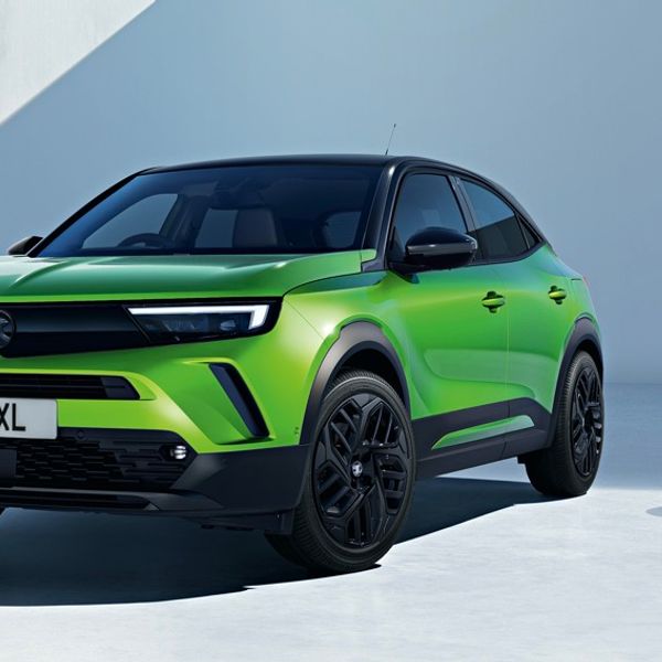 2023 Vauxhall Mokka, green, UK registration, next to charge point, in studio